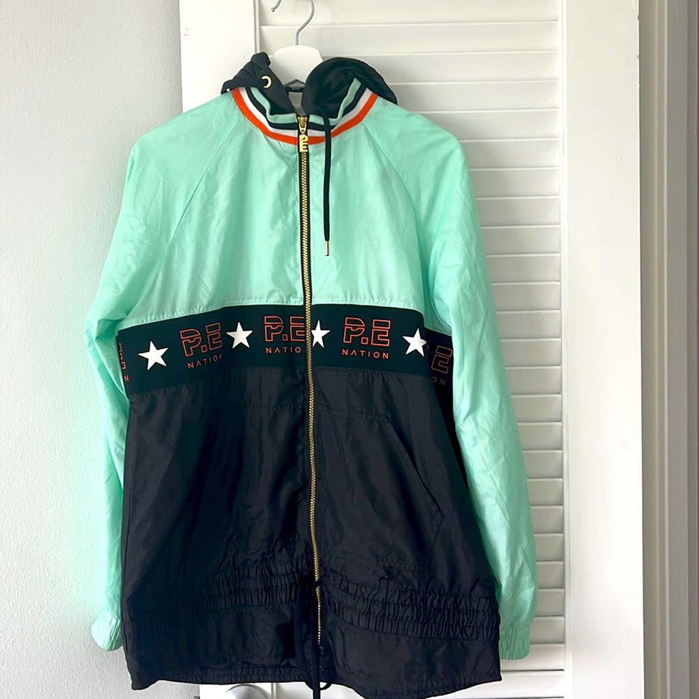 PE nation X H&M collaboration - aqua and black windbreaker